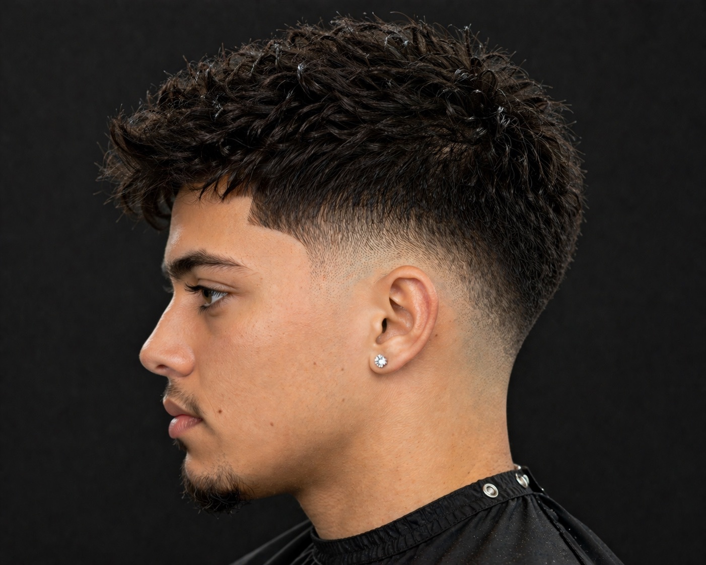 Mid Burst Fade With Piecey Curly Fringe — side profile barber reference photo showing the fade line and top shape