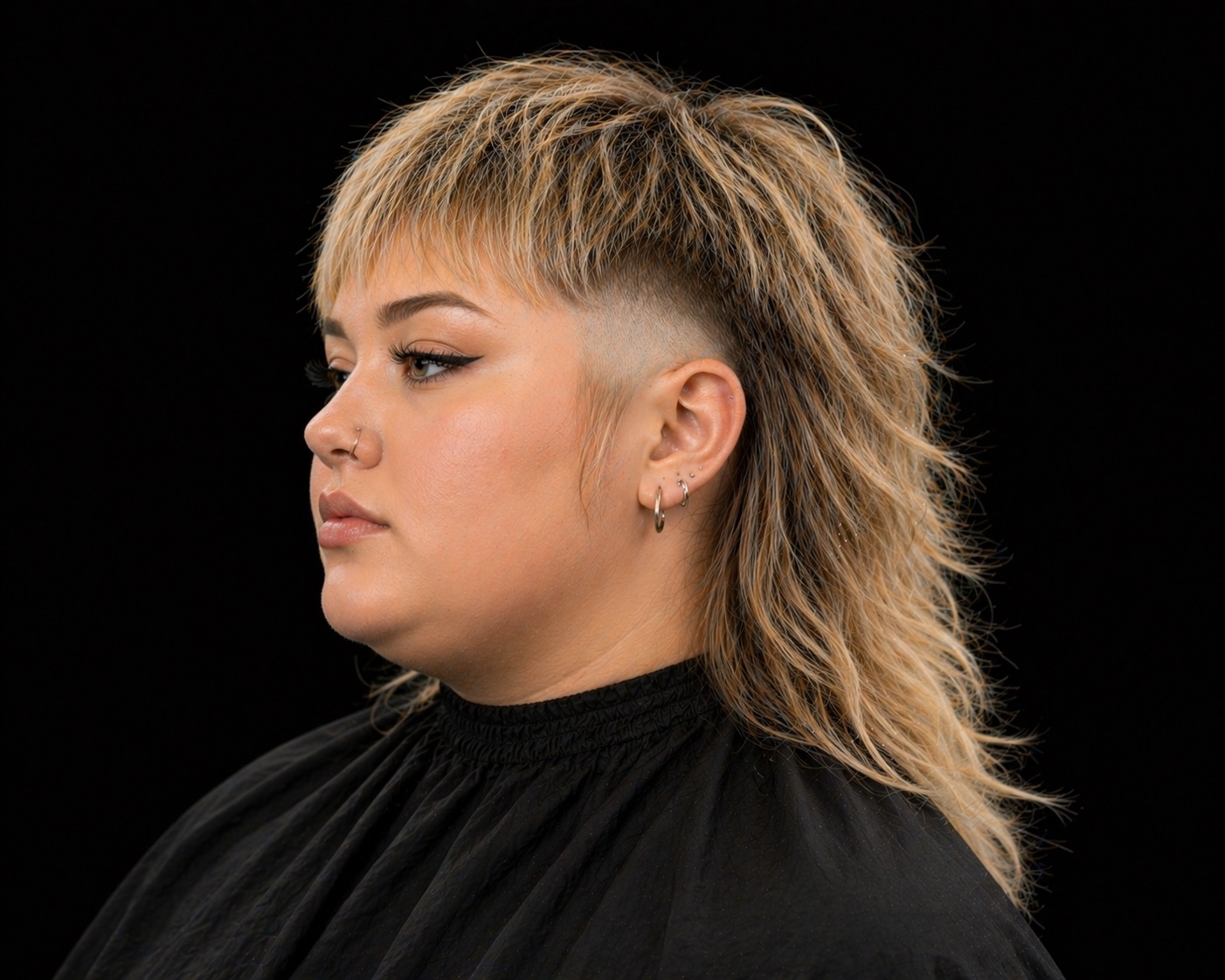 Shaggy Blonde Mullet With Disconnected Undercut — side profile barber reference photo showing the fade line and top shape
