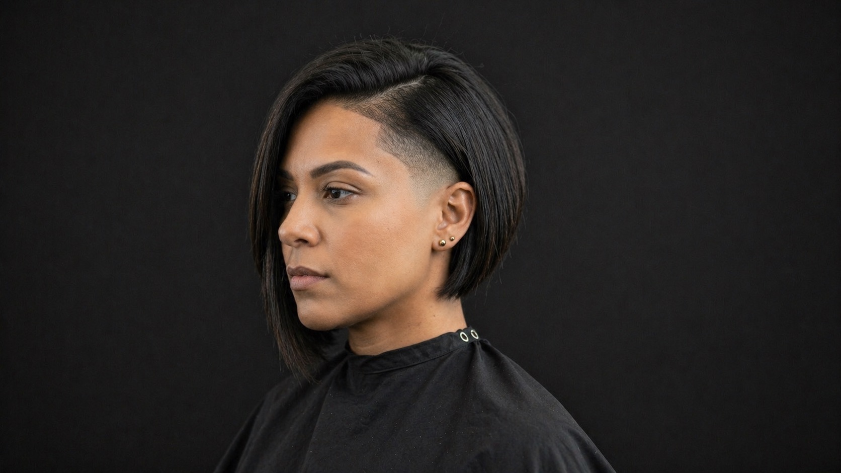 Angled Bob With Shaved Side Panel — side profile barber reference photo showing the fade line and top shape