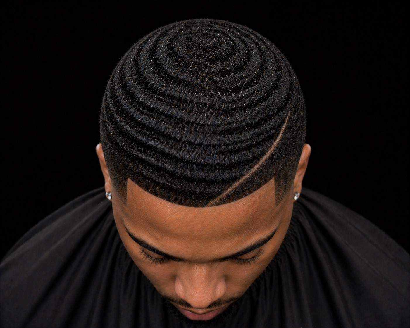 Deep Spinner Waves With Shaved Part — side profile barber reference photo showing the fade line and top shape