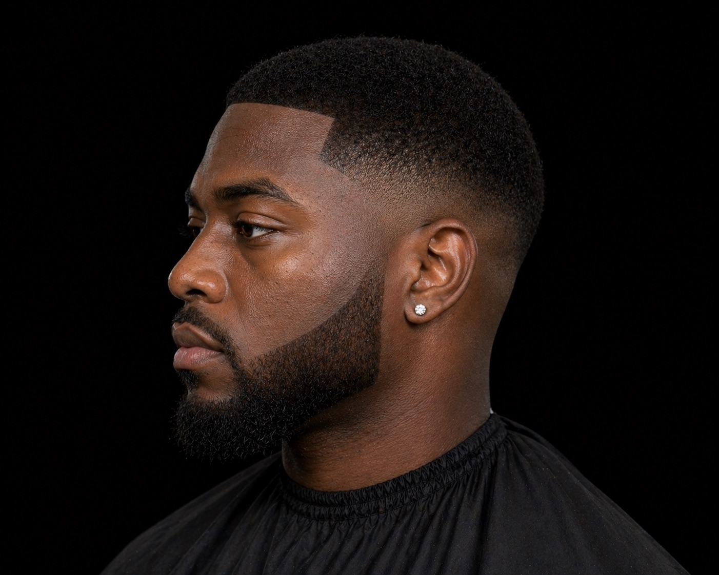 Low Fade Caesar With Full Connected Beard — side profile barber reference photo showing the fade line and top shape