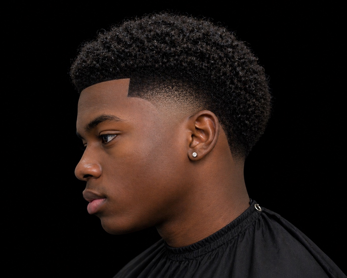 Boxed Temple Fade Coily Top — side profile barber reference photo showing the fade line and top shape