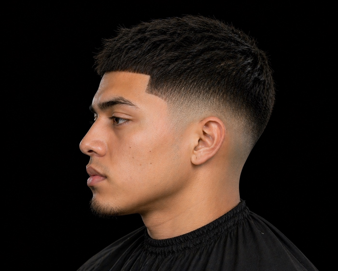Skin Fade With Full Coil Crown And Boxed Beard — side profile barber reference photo showing the fade line and top shape