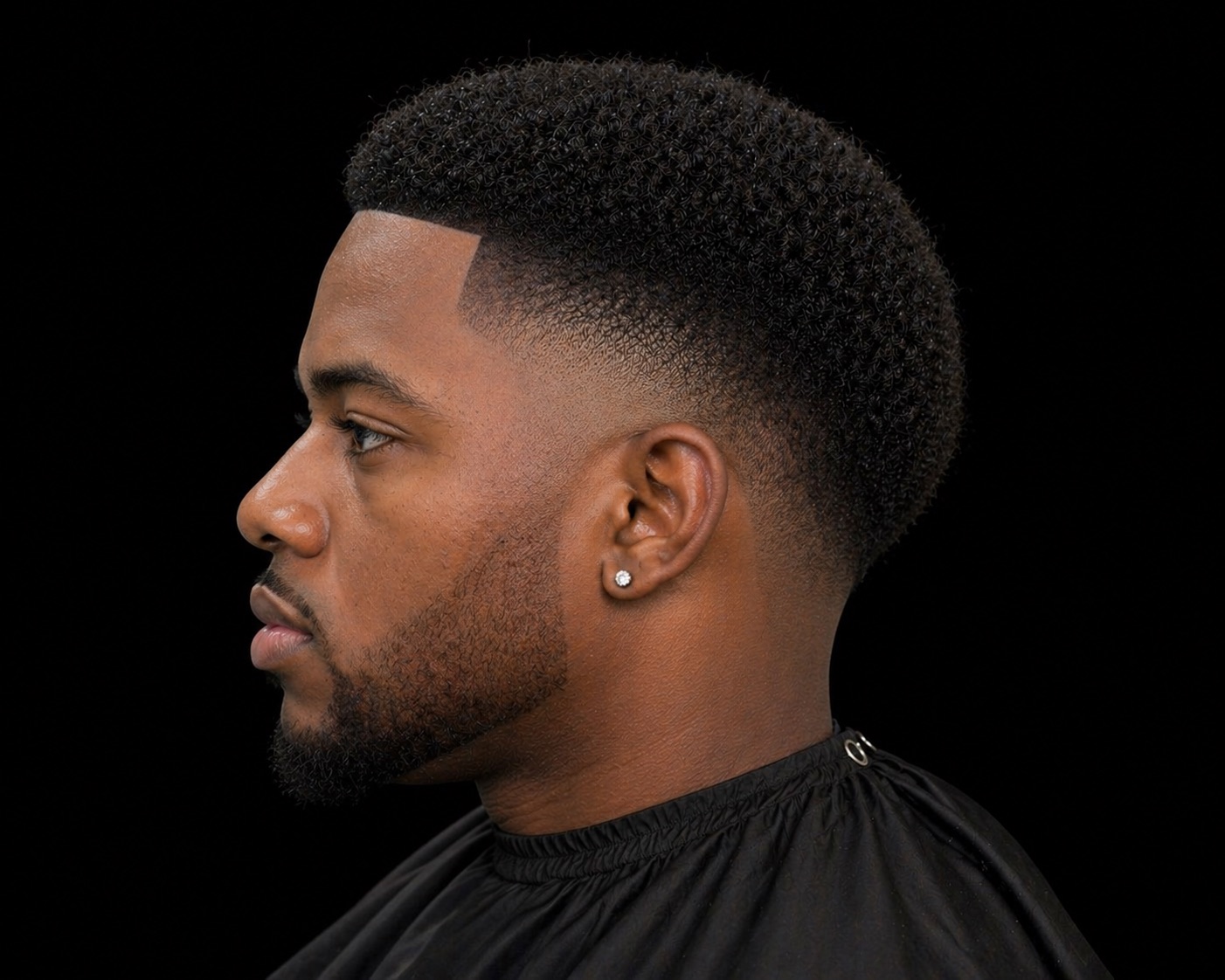 Mid Temple Fade With Tall Coily Box Top — side profile barber reference photo showing the fade line and top shape