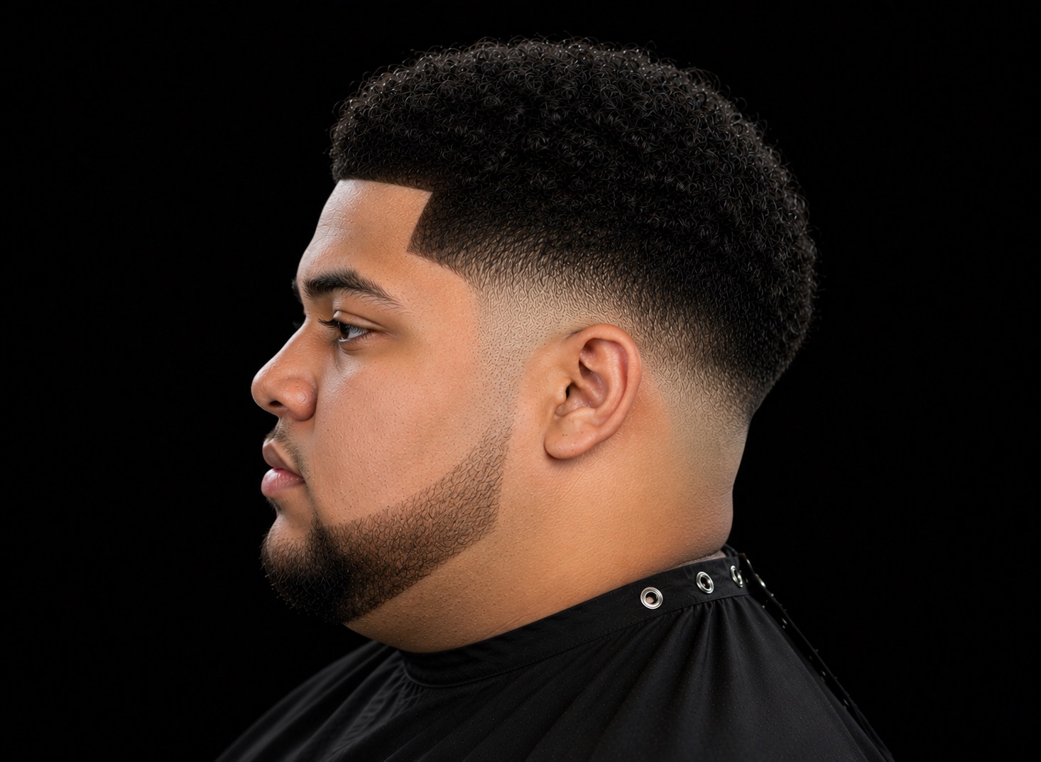 Rounded Coil Cap Mid Fade — side profile barber reference photo showing the fade line and top shape