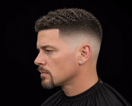 High Skin Fade with Coiled Crop and Hard Front Line — barber reference photo