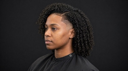 Curly Shoulder Length With Shaved Temple Wedge — barber reference photo